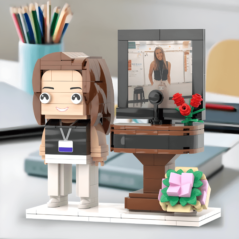 LEGO figure of a teacher with a desk setup, made from the photo