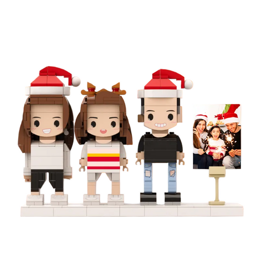 Set of 3 custom brick figures ready for Christmas next to a photo of th family