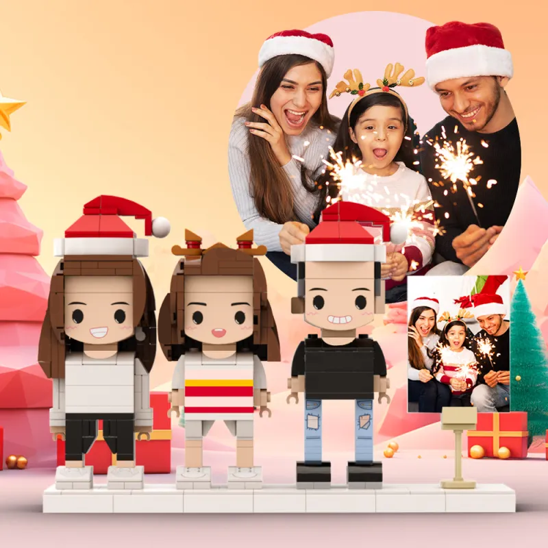 Toy figures of a family with Christmas hats in front of a family photo backdrop