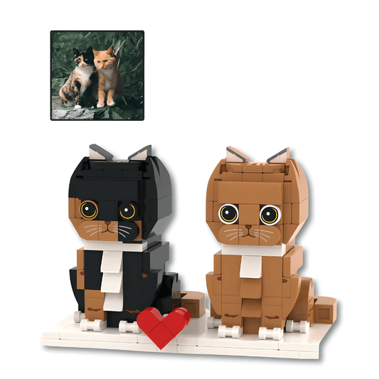Two LEGO cat models with a heart and a photo of real cats in the corner.