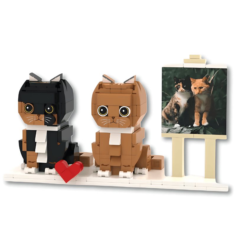 Two LEGO cats with a heart and a painting of two cats on an easel.