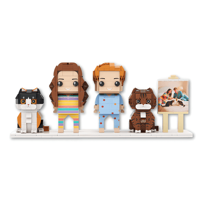 Set of personalised mini figures including a cat, two people, and a dog on a white background