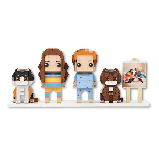 Set of personalised mini figures including a cat, two people, and a dog on a white background