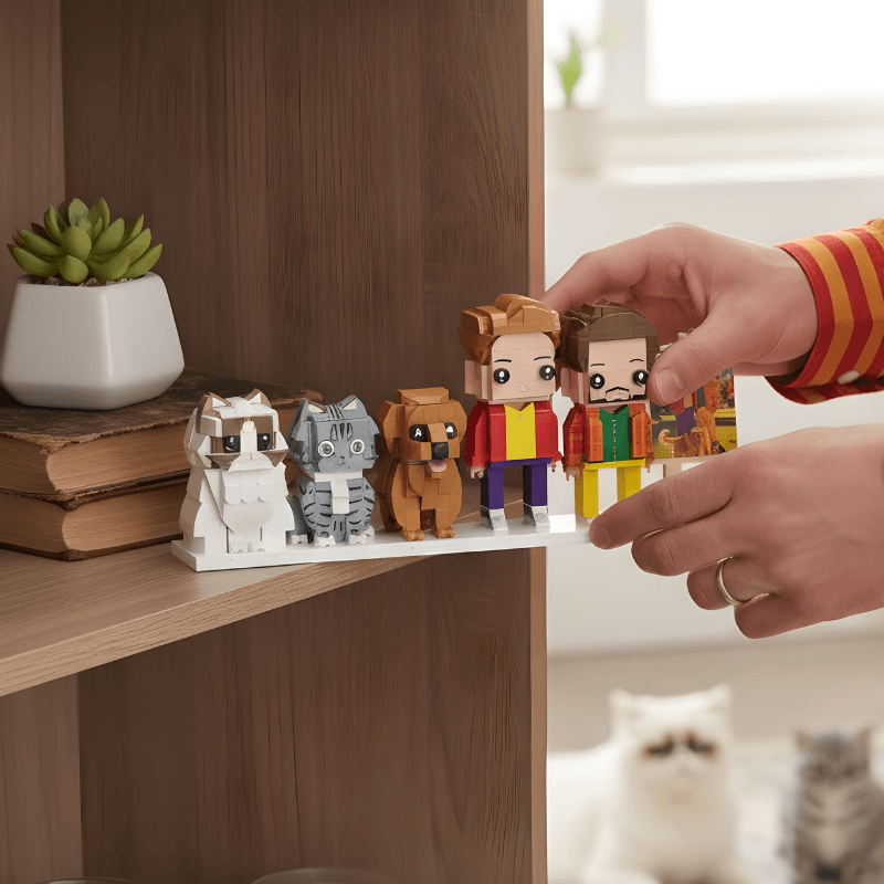 Person arranging LEGO figurines on a shelf with a cat in the background