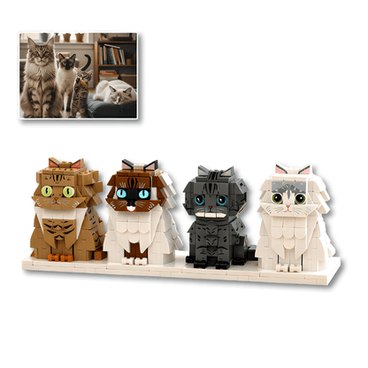 Four cat-shaped building block figures on a white surface with a small inset photo of real cats.