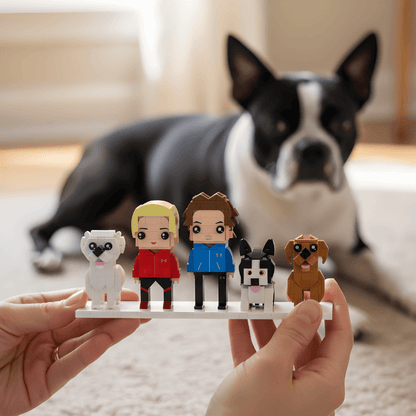 Person holding a small lego figurine display with cartoon-style characters in front of a dog.