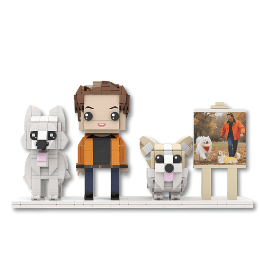 Brick-built figure of a person with two dogs on a white background