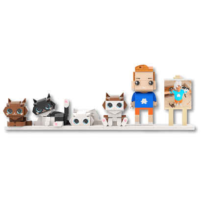 Set of small custom brick figurines on a white shelf against a white background