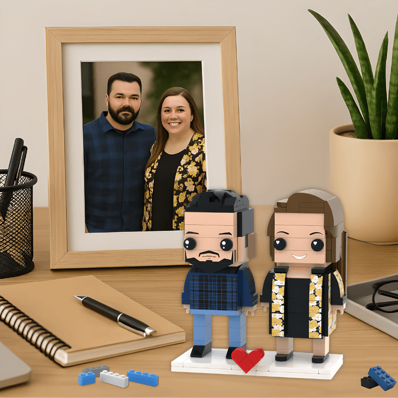 custom lego for couples image of brick figures on a desk next to the photo