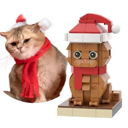 Cat wearing a Santa hat and scarf with a LEGO cat model in the background.