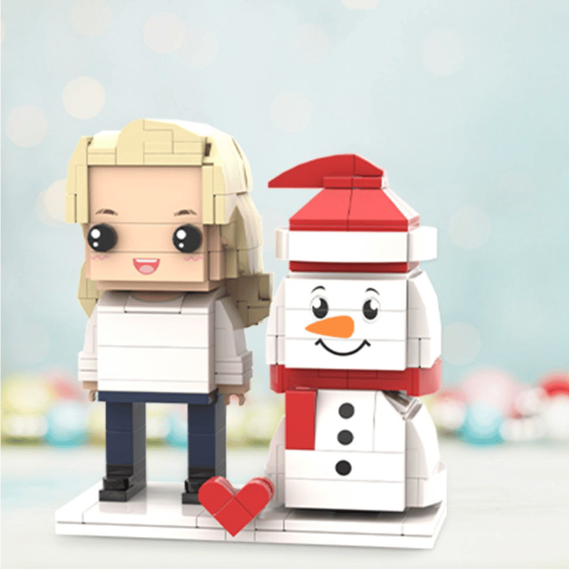 Brick-built character and snowman with a heart on a light blue background