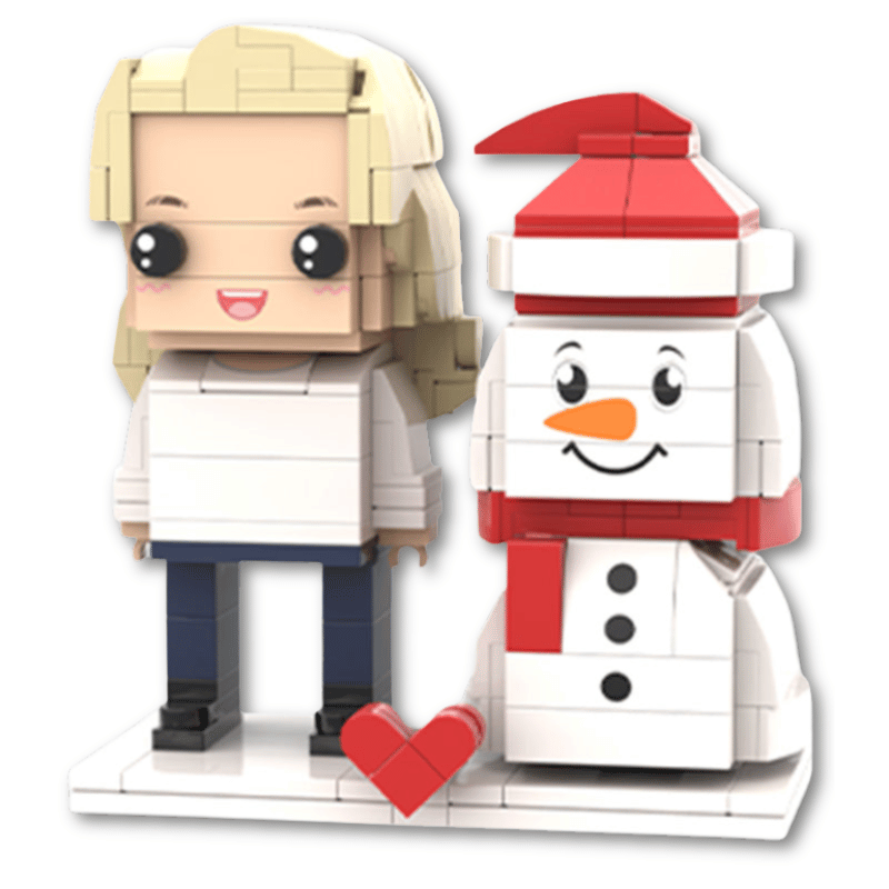 Two custom mini figures, one resembling a person with blonde hair and the other a snowman with a red hat and scarf, accompanied by a red heart.