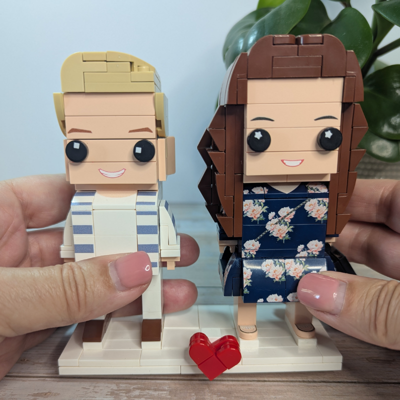 Two LEGO-style mini figures of a couple  to show size