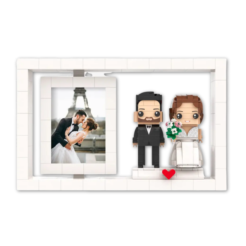 Framed photo of a couple with lego mini figurines of a bride and groom on a white background