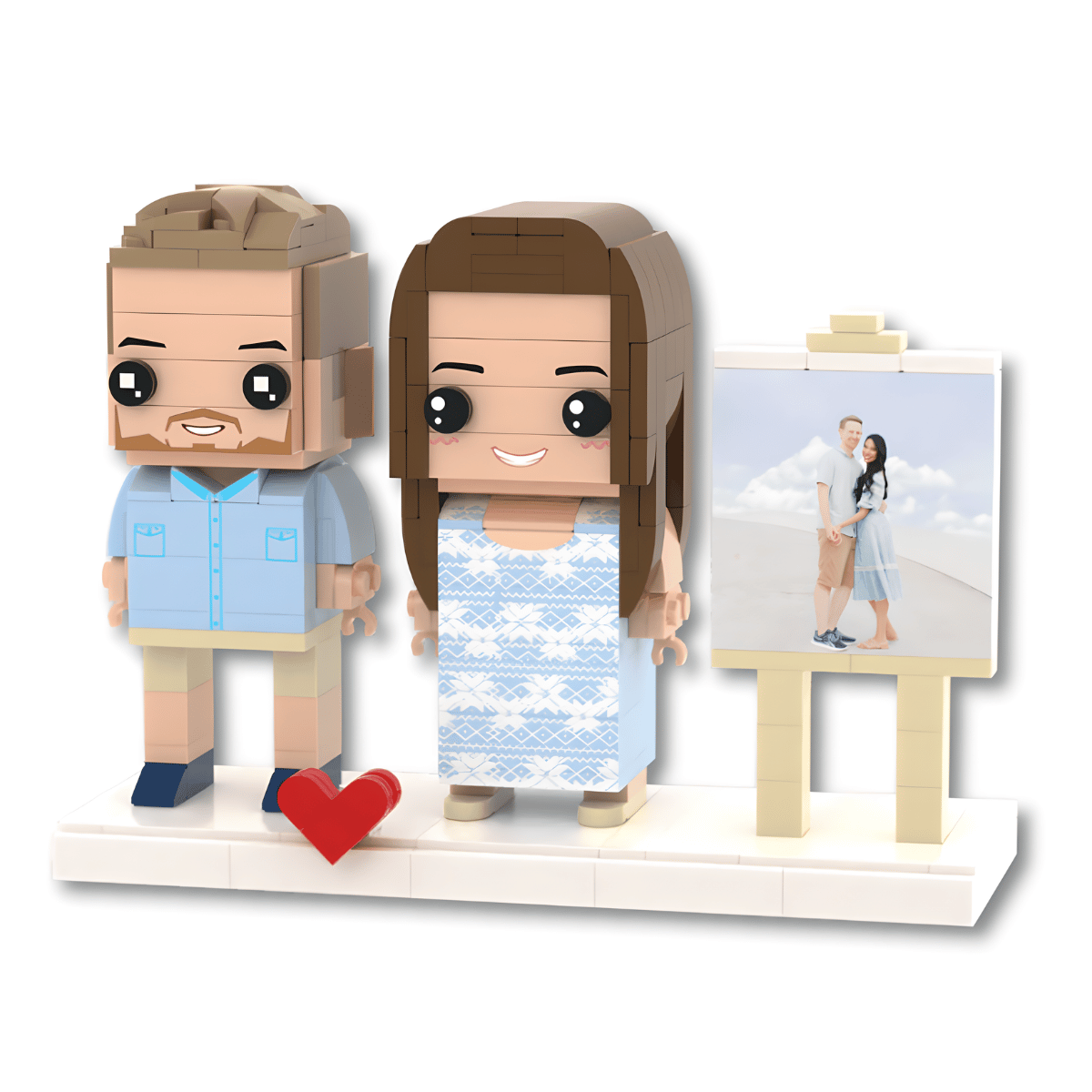 Custom couple brick figure set featuring a couple of personalized character figures and an easel with a photo print, on a white display base with a red heart accent, isolated on a white background.