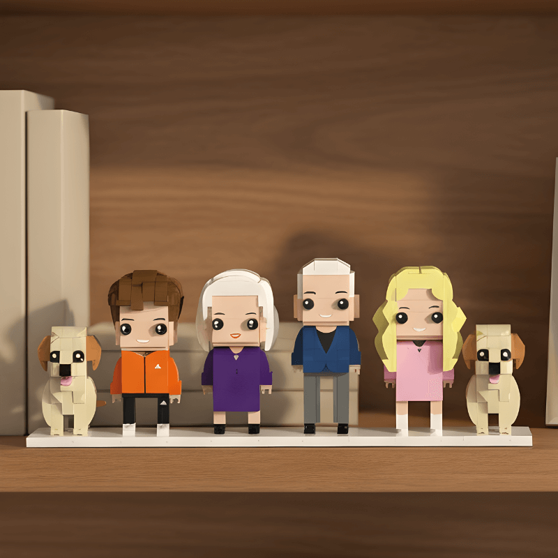 Personalised mini figurines of a family with two dogs on a wooden surface.