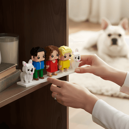 Person arranging custom mini family figurines on a shelf with a dog in the background