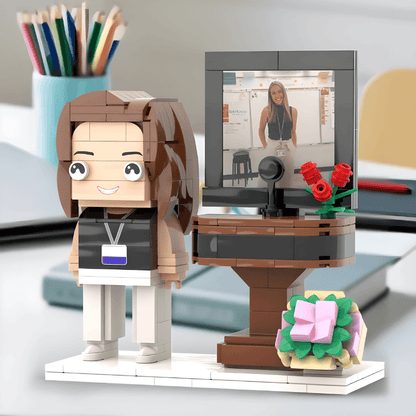 LEGO figure of a teacher with a desk setup, made from the photo