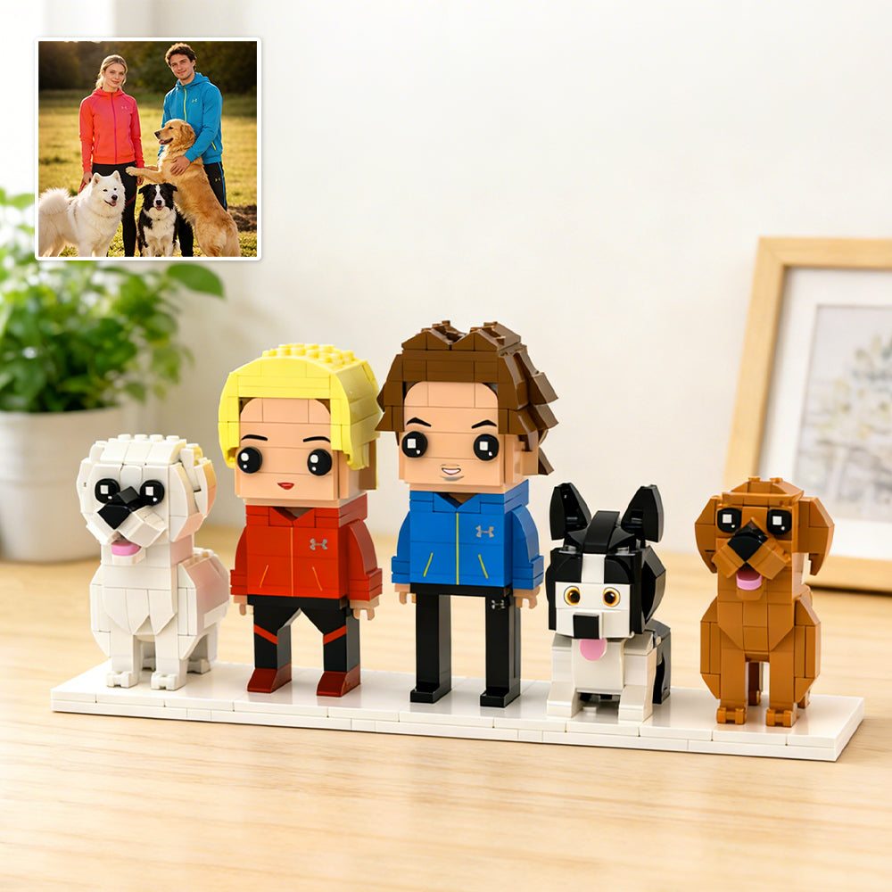 Brick-built figures of people and dogs on a display stand with a photo of real people and dogs in the corner.