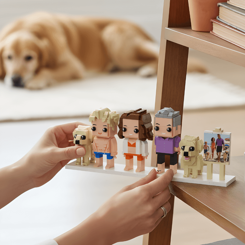 Person holding a display of lego stylefigurines with a dog in the background