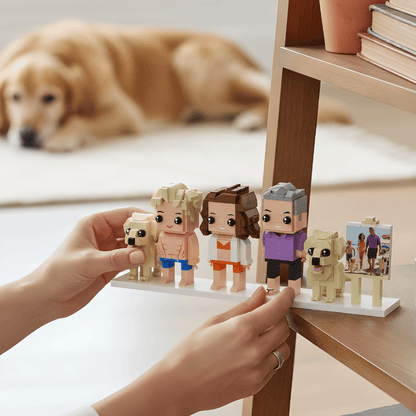 Person holding a display of lego stylefigurines with a dog in the background