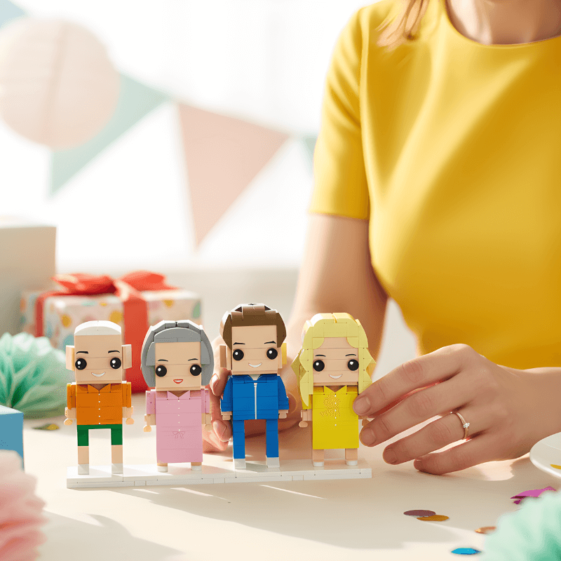 Person arranging colorful custom mini figures on a table with a blurred background