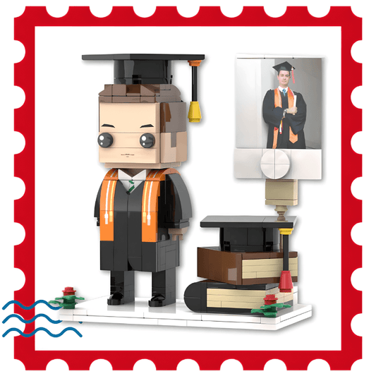 Graduation figurines Lego set with a student figure, books, and cap in a decorative frame.