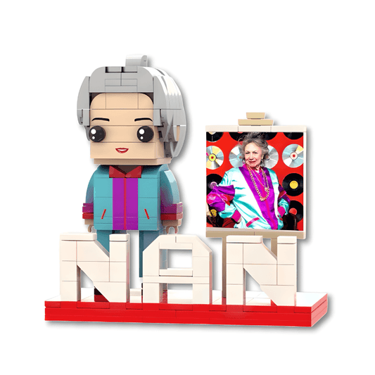 Brick figure of a person with a painting on an easel, featuring the name 'NAN'.