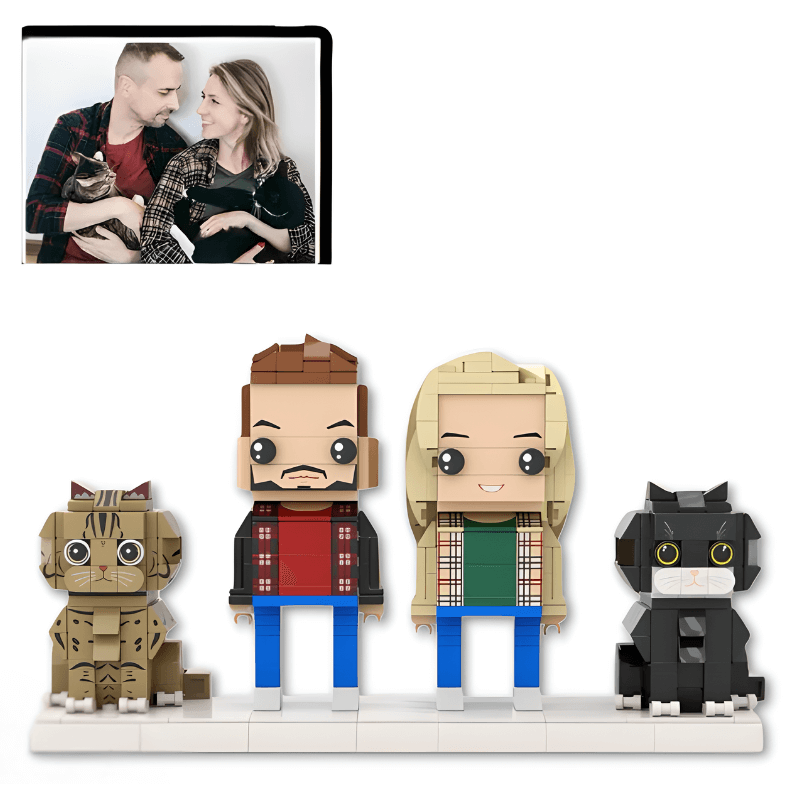 personalised mini figures of a couple and their cats with a photo of the couple holding a cat above them.