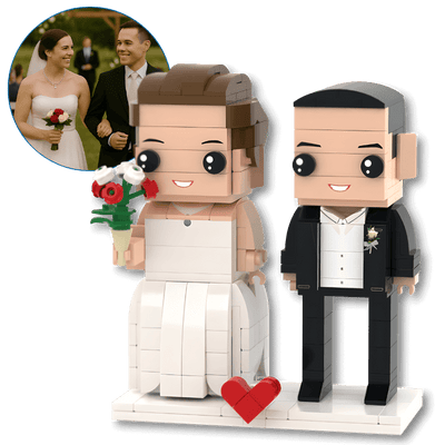 custom mini figures of a bride and groom with a heart-shaped base, inspired by a real wedding photo.