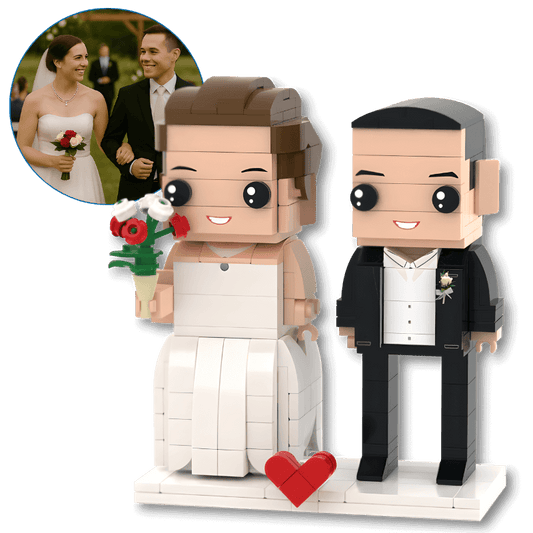custom mini figures of a bride and groom with a heart-shaped base, inspired by a real wedding photo.